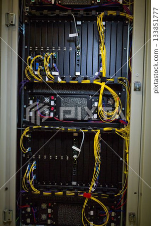 Server rack cabinet is being shown in vector illustration, with yellow fiber and patch cables 133851777