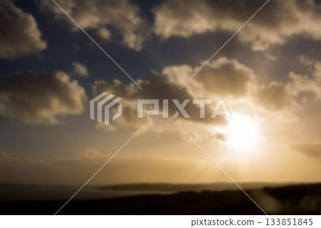 Scenic view of landscape against sky with sun 133851845