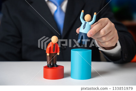 The businessman marks the winner and promotes him. Career advancement, employee recognition and merit based rewards. HR motivation , leadership training and corporate success stories. 133851979