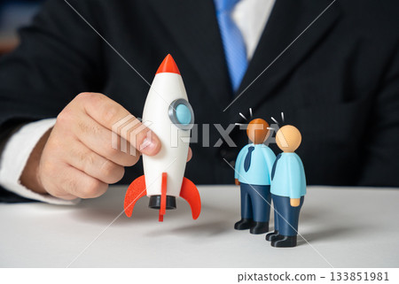 A businessman presents a rocket to investors. An invitation to candidates to board the project. Startup launch, innovation pitching and rapid business growth. Investment and entrepreneurship A businessman presents a rocket to investors. An invitation to candidates to board the project. Startup launch, innovation pitching and rapid business growth. Investment and entrepreneurship 133851981