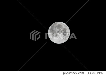 Full moon floating in the night sky 133851992