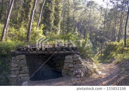 small shelter built with stones in the mountain small shelter built with stones in the mountain 133852106