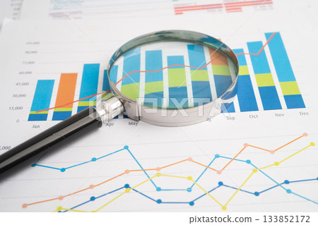 Magnifying glass on charts graphs paper. Financial development, Banking Account, Statistic, Investment Analytic research data economy. 133852172