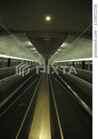 escalators of the train station that go to the platform escalators of the train station that go to the platform 133852258