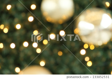 Festive Christmas Bokeh Background with Golden Ornaments and Sparkling Lights. Festive Christmas Bokeh Background with Golden Ornaments and Sparkling Lights. 133852531