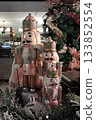 Nutcracker toys next to a Christmas tree 133852554