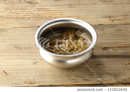 Chicken curry served on silver tableware 133852648