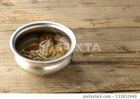 Chicken curry served on silver tableware 133852649