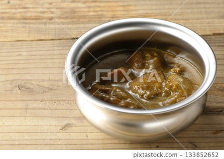 Chicken curry served on silver tableware Chicken curry served on silver tableware 133852652