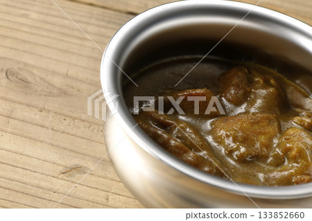 Chicken curry served on silver tableware Chicken curry served on silver tableware 133852660