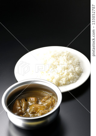 Chicken curry and rice served on silver tableware 133852787