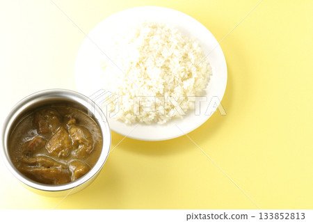 Chicken curry and rice served on silver tableware Chicken curry and rice served on silver tableware 133852813