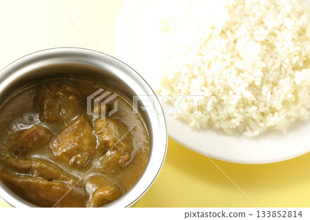 Chicken curry and rice served on silver tableware Chicken curry and rice served on silver tableware 133852814