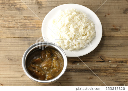 Chicken curry and rice served on silver tableware Chicken curry and rice served on silver tableware 133852820