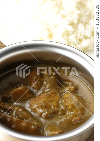 Chicken curry and rice served on silver tableware Chicken curry and rice served on silver tableware 133852828