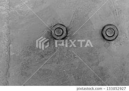Detailed closeup of screw on indrustrial machinery 133852927