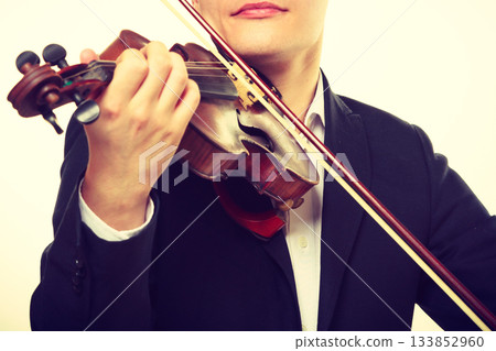 Man man dressed elegantly playing violin Man man dressed elegantly playing violin 133852960