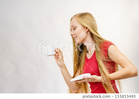 Blonde girl with coffee cup Blonde girl with coffee cup 133853493