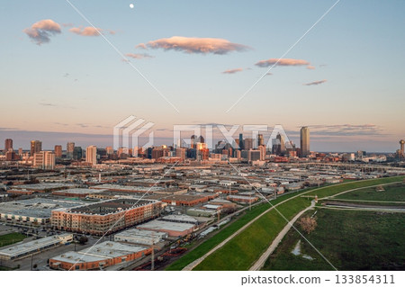 Golden hour aerial view of Dallas skyline above urban districts 133854311