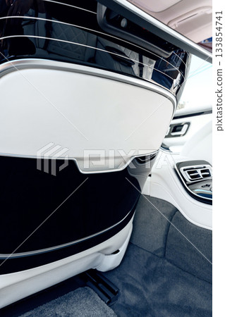 Luxury car interior showcasing modern design features and comfortable seating 133854741