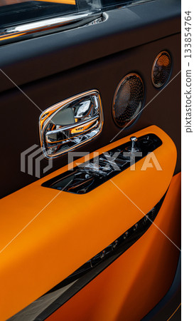 Luxury car interior showcasing high-end materials and sleek design details 133854764