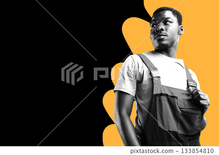 Young man wearing overalls poses confidently against a bright bold background 133854810
