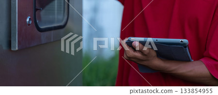 Electrical engineer working in control room. Electrical engineer working in control room. 133854955