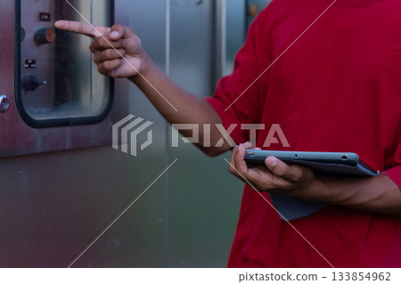 Electrical engineer working in control room.  133854962