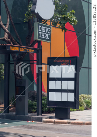 Drive thru sign in fast food restaurant. Drive thru sign into the shop. 133855128