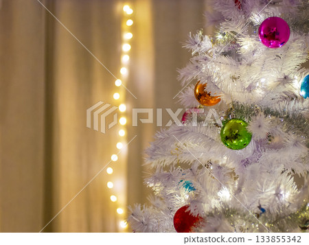 White Christmas Tree with Colorful Ornaments 133855342