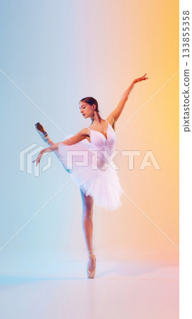 Dancer in blurred expressive motion on soft gradient background 133855358