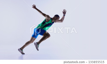 Runner advancing from crouched start into acceleration phase Runner advancing from crouched start into acceleration phase 133855515
