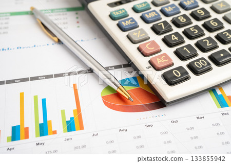 Calculator with pen on data business graphs paper. 133855942