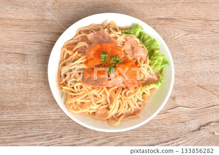 spicy stir fried spaghetti with slice ham pork dressing Rose Korean sauce topping shrimp egg on plate spicy stir fried spaghetti with slice ham pork dressing Rose Korean sauce topping shrimp egg on plate 133856282