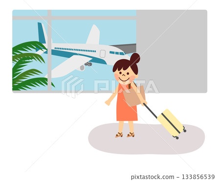 機場裡一位帶著行李箱的女士 133856539