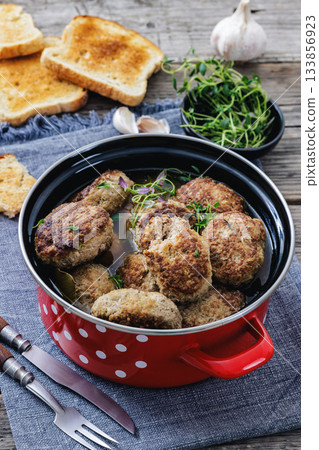 Frikadellen, Minced Meat Patties in a red pot 133856923