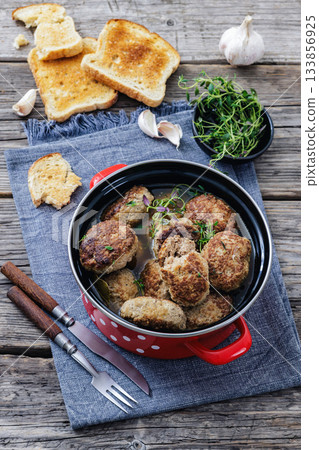 Frikadellen, Minced Meat Patties in a red pot 133856925