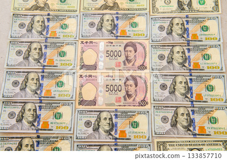 100, 20, and 1 dollar bills. Japanese 5,000 yen bill surrounded by male leaders. Female leader. Sharp, directly above. 100, 20, and 1 dollar bills. Japanese 5,000 yen bill surrounded by male leaders. Female leader. Sharp, directly above. 133857710