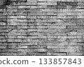 Old grunge weathered gray brick wall background texture 133857843
