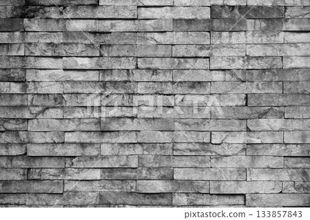 Old grunge weathered gray brick wall background texture 133857843