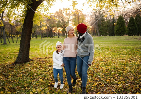 Diverse family generations walking together autumn park 133858001