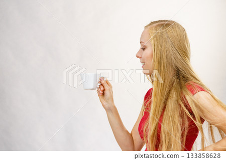 Blonde girl with coffee cup Blonde girl with coffee cup 133858628
