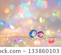 Rainbow bokeh and sparkling jewels / Jewelry background wrapped in colorful light Rainbow bokeh and sparkling jewels / Jewelry background wrapped in colorful light 133860103