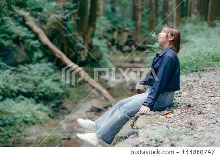 Woman taking a break in nature Woman taking a break in nature 133860747