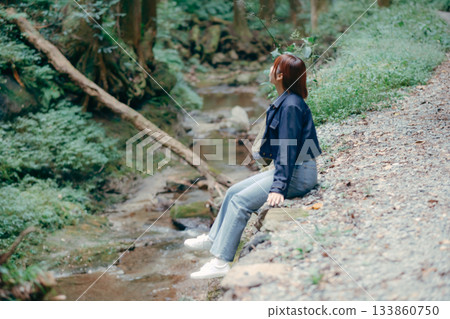 Woman taking a break in nature 133860750