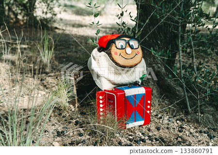 a Tio de Nadal with glasses in the forest 133860791