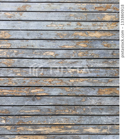 Wooden wall with weathered planks showcasing rustic texture and charm 133860918
