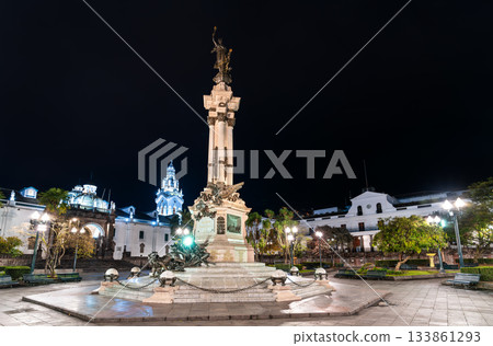 Independence Monument stands in center of Plaza Grande in Quito, Ecuador. Historic column features statue of Liberty and lions surrounded by colonial buildings at night Independence Monument stands in center of Plaza Grande in Quito, Ecuador. Historic column features statue of Liberty and lions surrounded by colonial buildings at night 133861293