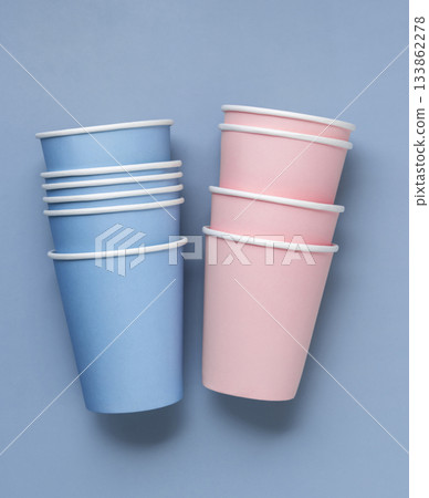 Disposable light blue and pink paper cups topview, mockup, copy space. 133862278