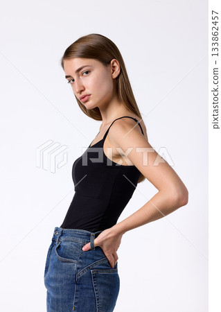 Slavic beauty in black top posing confidently Slavic beauty in black top posing confidently 133862457